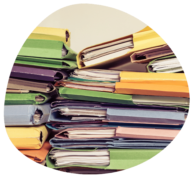 A pile of paper management system documents emphasises the need to digitise using Southpac Plus.